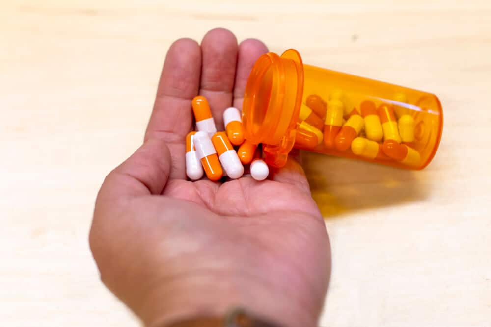 Healthcare medication orange bottle with pill drugs